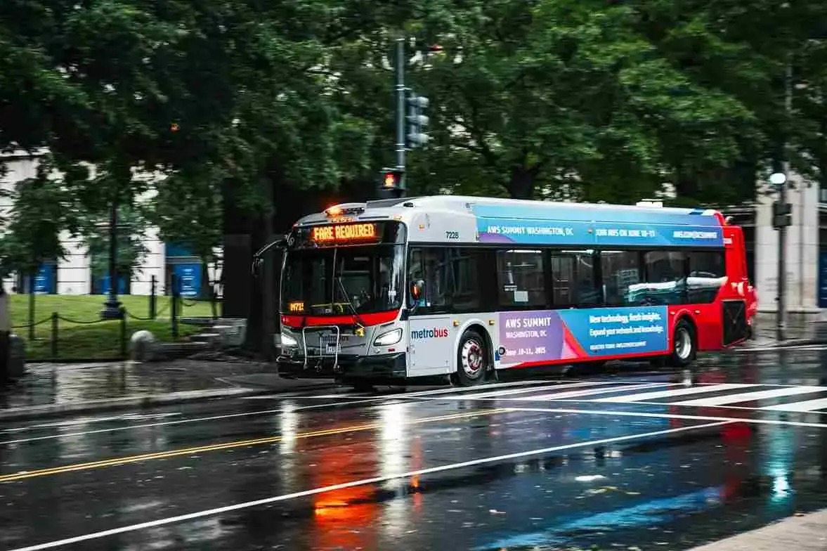 City transit bus on a wet street
